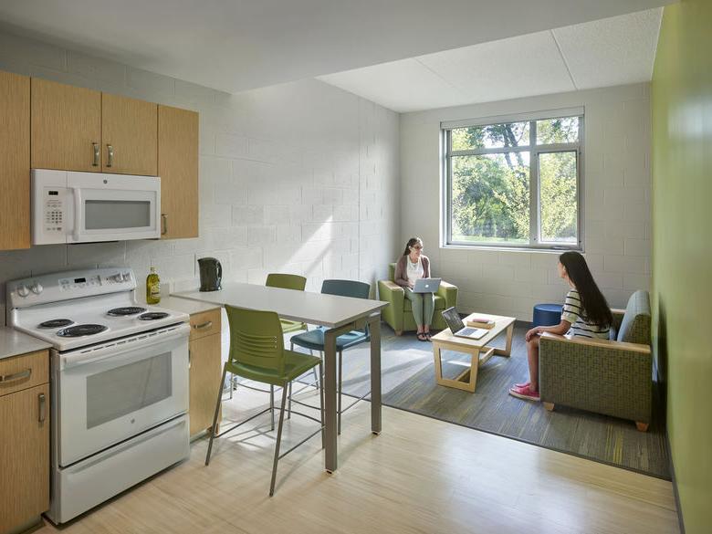 two student sitting in living room