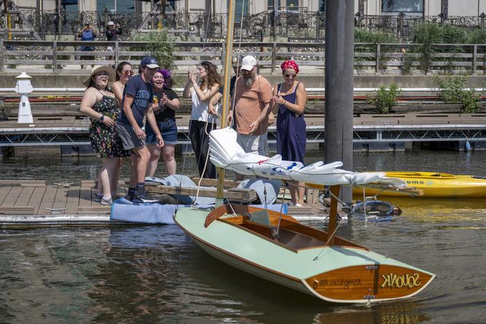 Penn State Abington students putting the duckboat Squonk into the water