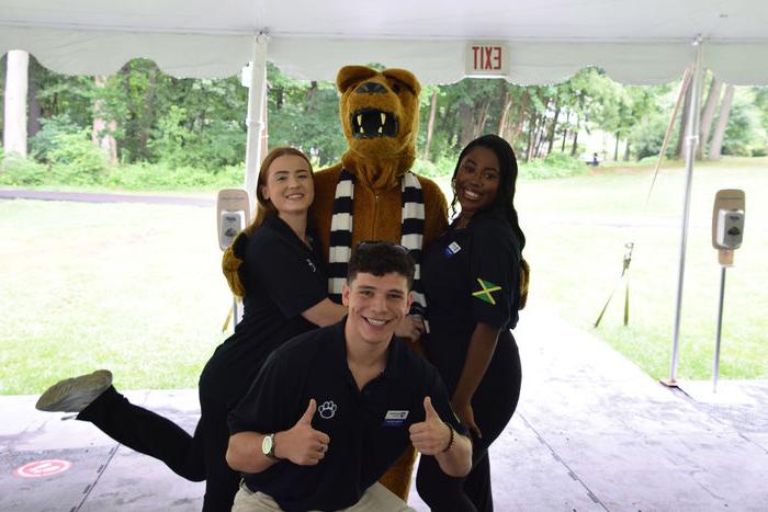 three students posing with Nittany Lion at Penn State Abington (near Philadelphia)