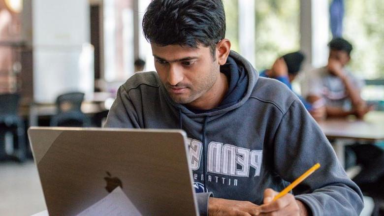 Student working on a laptop